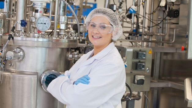 Scientist in a life sciences cleanroom production facility