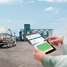 Man with iPad in front of food plant